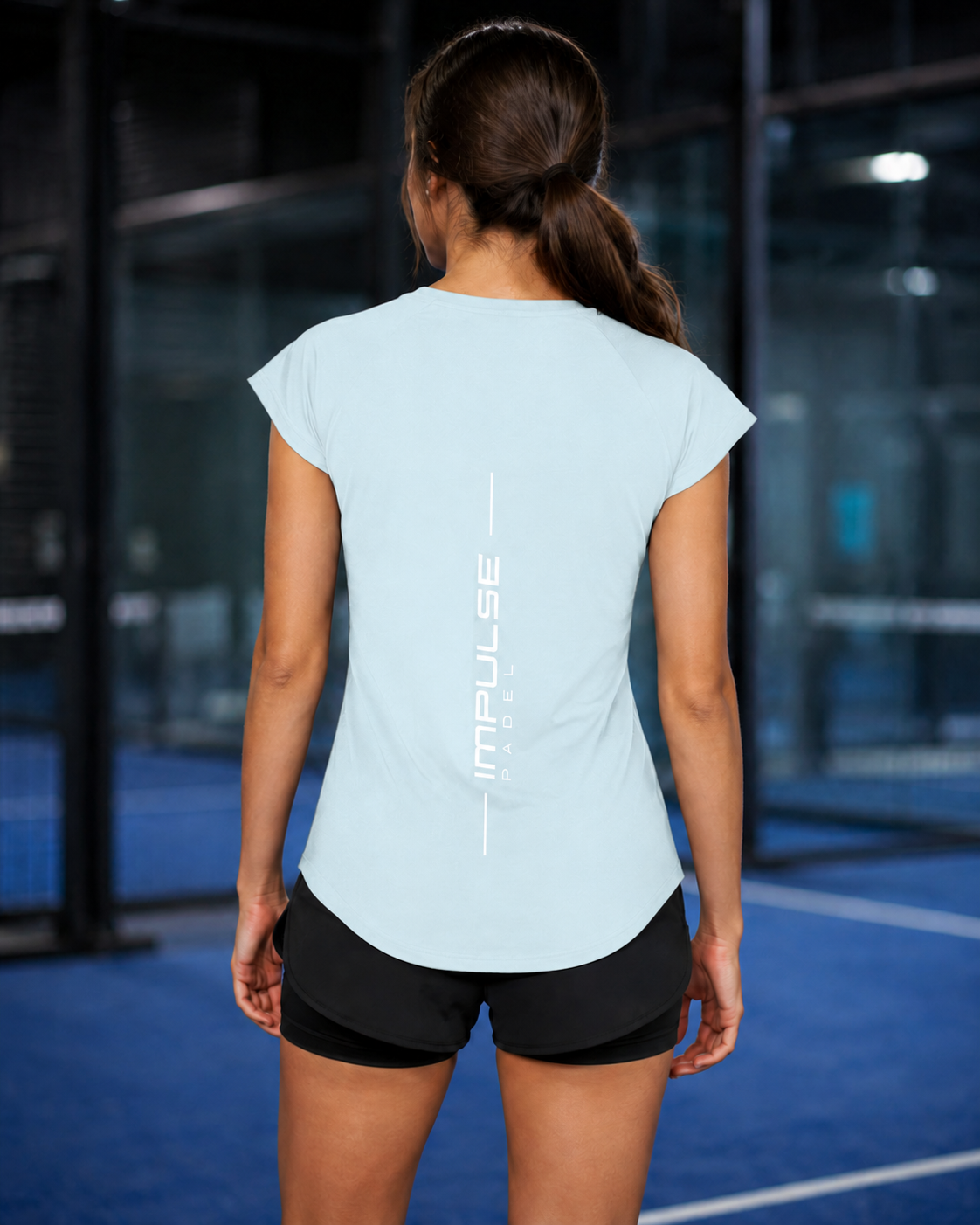 T-shirt technique femme bleu glacier vu de dos avec marquage vertical Impulse Padel