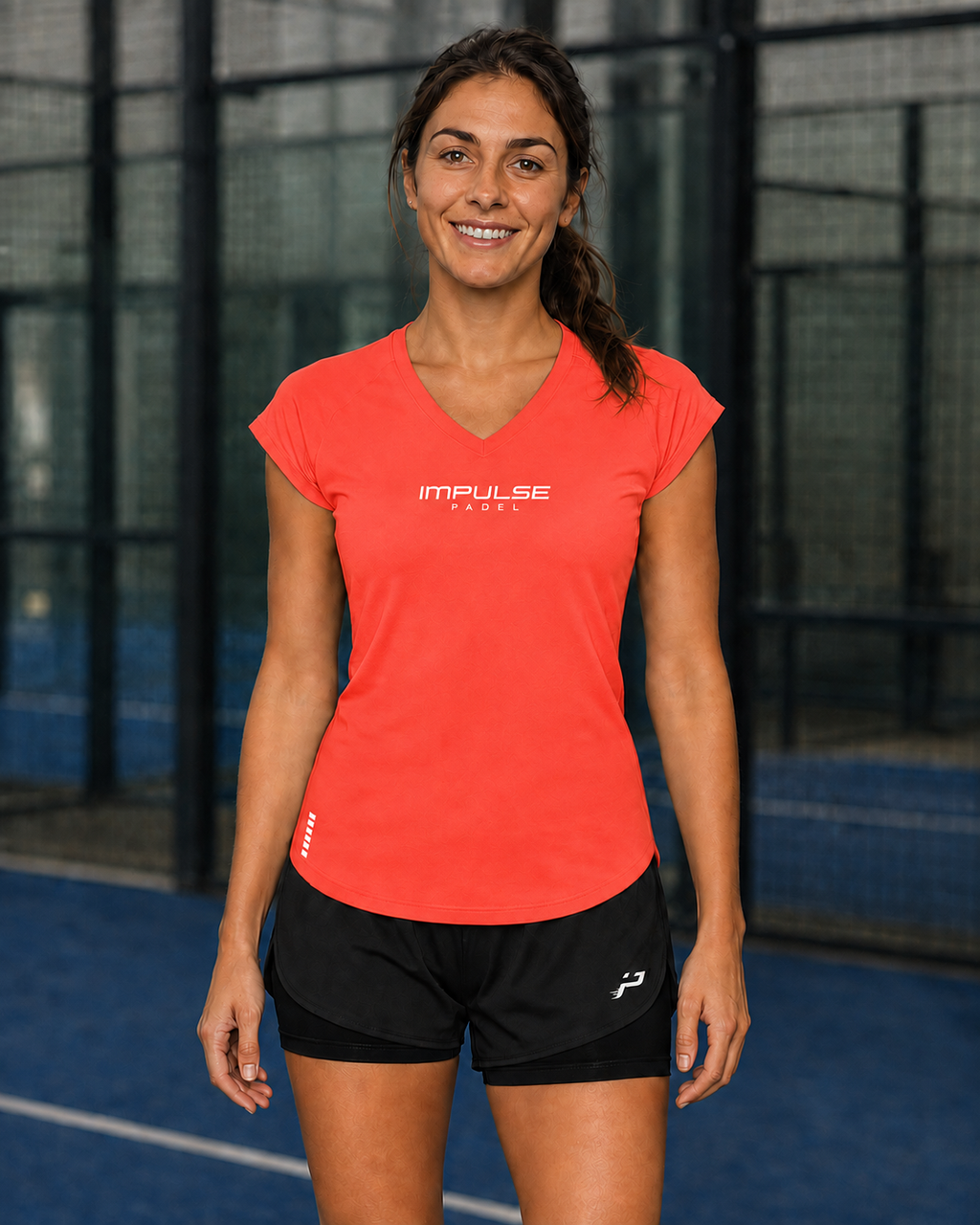 T-shirt technique de padel femme corail Impulse Padel porté de face